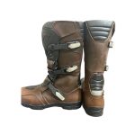 Kvell brown leather adventure motorcycle boots with TPU protection and adjustable buckle closures.